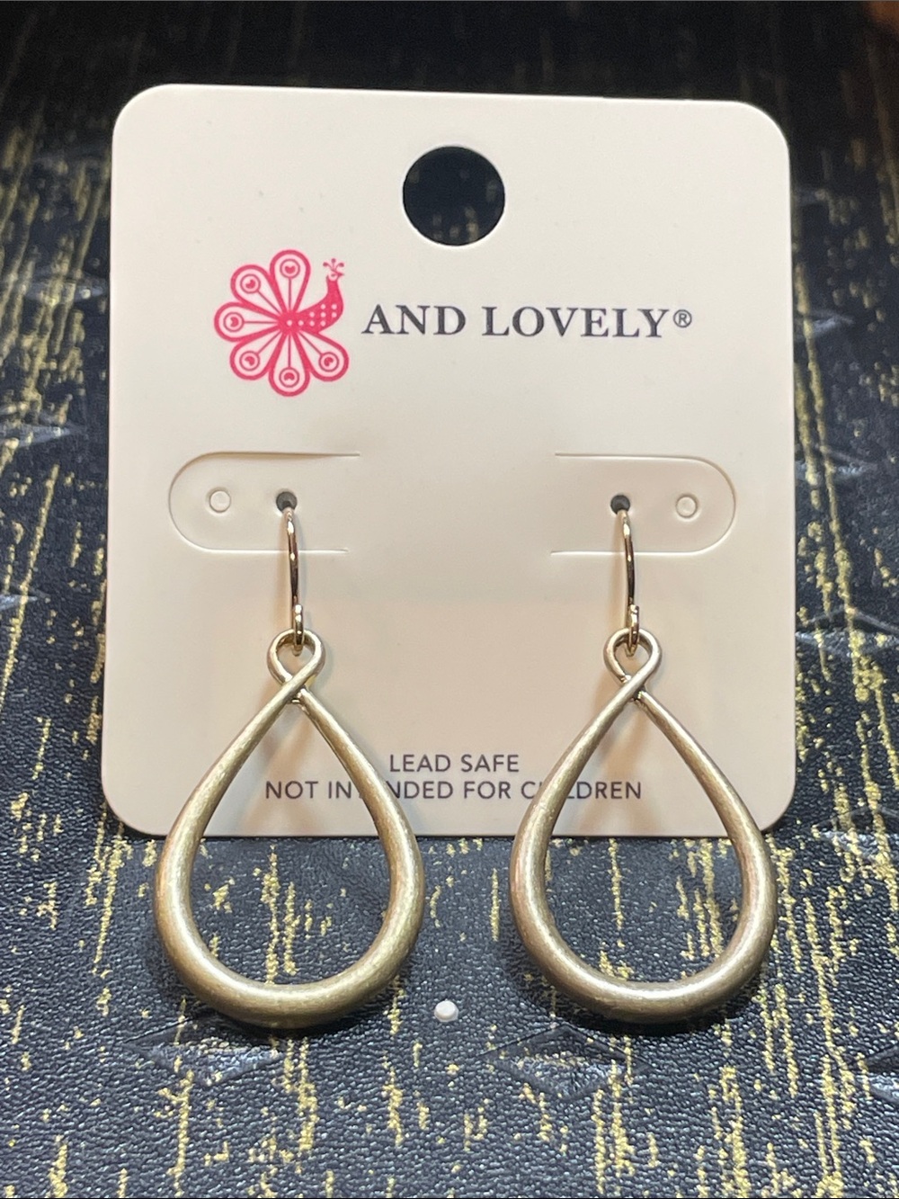 And Lovely Gold Teardrop Hoop Earrings